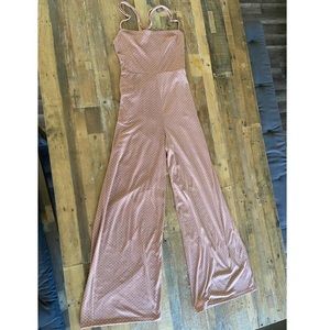 pink polka dot jumpsuit with lace up back